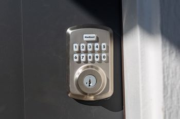Kwikset digital keypad entry lock with numbered buttons